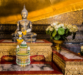 A Buddha and other religious symbols
