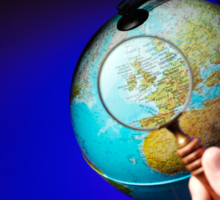 KS1 Geography Illustration – Magnifying Glass on a World Globe
