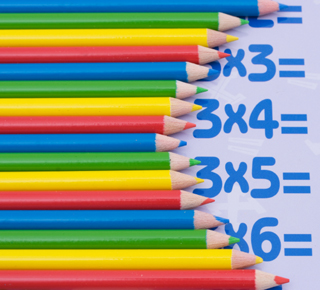 KS1 Times Table Illustration – Colourful Pencils on a Table
