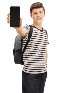 Teenage schoolboy holding iPad