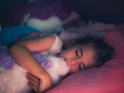 Content young girl enjoying a good night's sleep