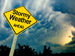 Cloudy sky with stormy weather roadsign
