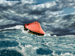 Life raft floating in stormy sea