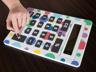 A hand using a very large calculator
