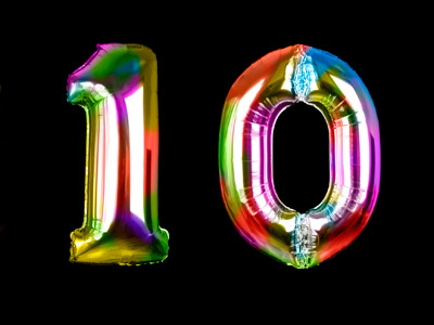 Two bright balloons in the shape of a number 10