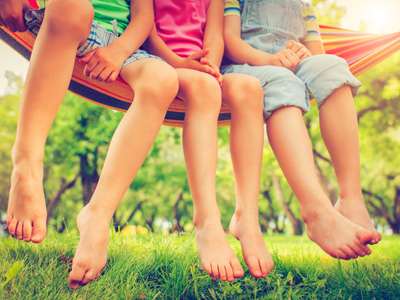 Children's feet dangling over the ground