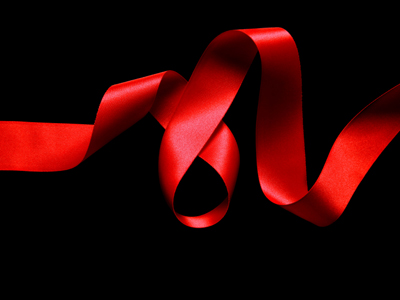 A red ribbon on a black background