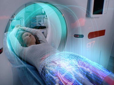 Person lying in an MRI scanner, with a digital overlay suggesting AI analysis of the images, illustrating hospital trials where AI reads scans quickly for same-day results.