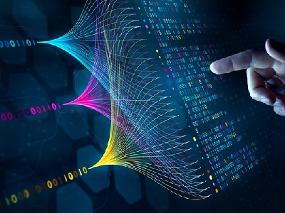 A hand pointing at colourful digital lines and binary code, representing machine learning and how computers process and learn from data patterns.