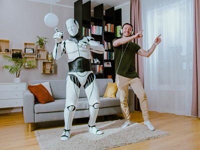 A humanoid robot and a man dancing together in a modern living room, with bookshelves, a sofa, and curtains in the background, illustrating fun AI integration in daily life.