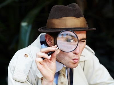 Smartphone screen showing a banking app scanning an online marketplace listing for scams, with a magnifying glass or shield icon and a friendly warning banner.