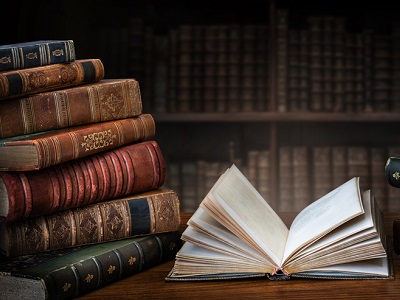 Illustration of a friendly robot launching a rocket-powered book labelled “Grokipedia,” with stars and a simple skyline, suitable for a children’s AI news quiz header image.