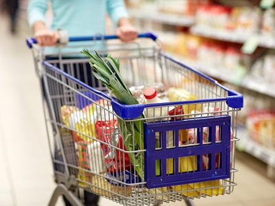 A supermarket shopping trolley filled with groceries, symbolising Waitrose’s trial of AI-powered smart trolleys that track items and prices in real time.
