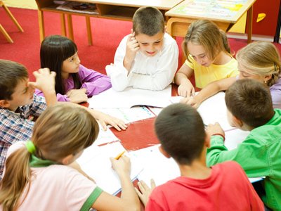 Discussion group kids sitting in a classroom