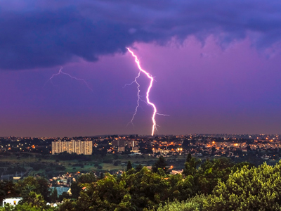 A bolt of lightning striking a city.