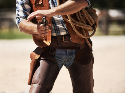 Wild west gunslinger pointing gun