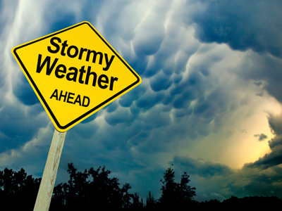 Cloudy sky with stormy weather roadsign