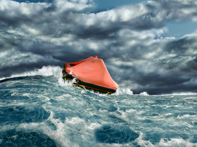 Life raft floating in stormy sea