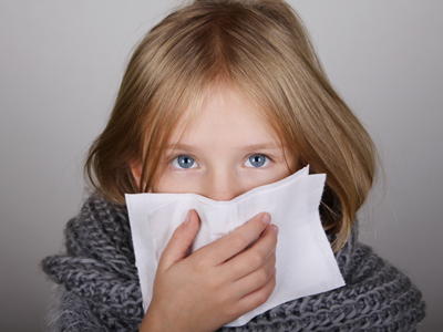 Child blowing her nose