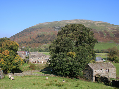 Village beside a hill