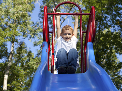 Child playing on slide