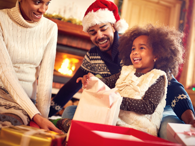 Child opening Christmas presents