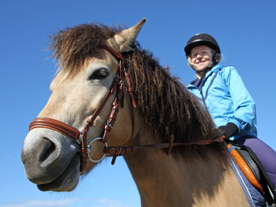 Child riding a horse