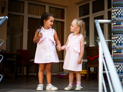 Children wearing the same dress