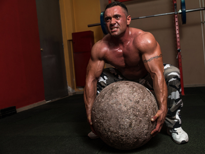 Strongman lifting stone