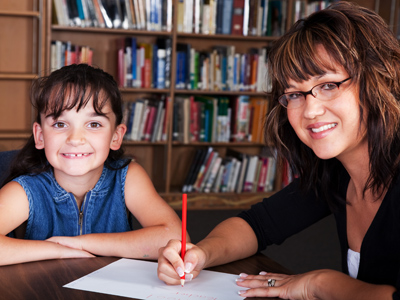 Child being marked on addition test