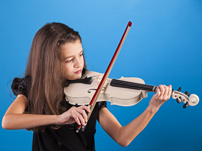 Child learning to play violin