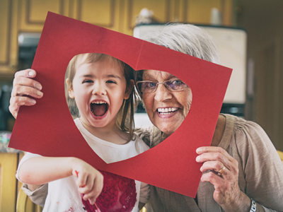 Grandma and young girl with open mouth 