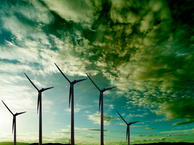 A wind farm against a dramatic sky