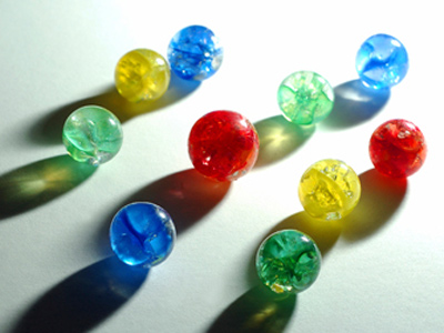 A collection of blue, green yellow and red marbles