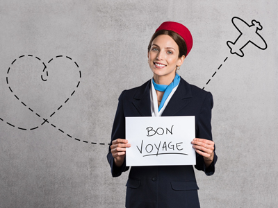 Stewardess with 'Bon Voyage' sign