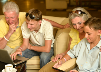 Grandparents With Grandchildren On Computers