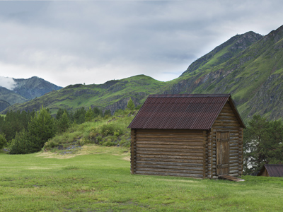 Wooden cabin beside mountains