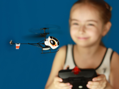 Child playing with model helicopter