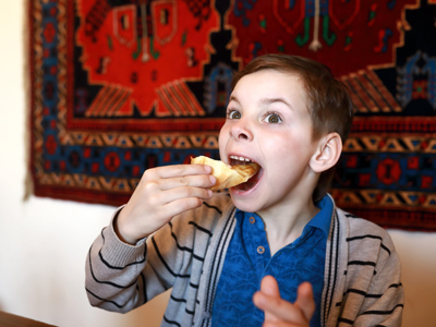 Child eating a piece of pie