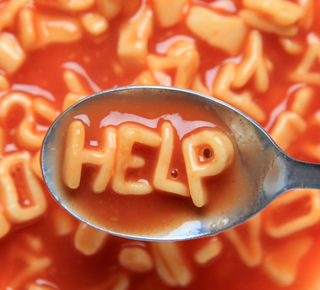 Alphabet soup that is spelling 'Help'
