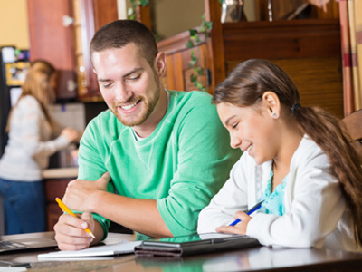 Parent supervising his daughter online