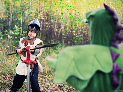 Boy acting out his dream of being a knight