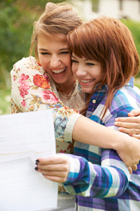 Teenage girls celebrating exam results