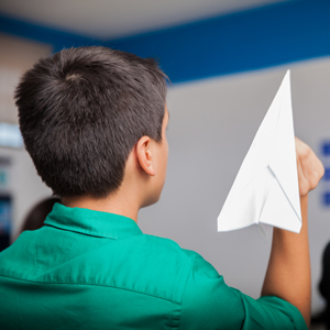 Child with paper aeroplane