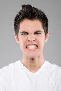 Angry and moody teenage boy