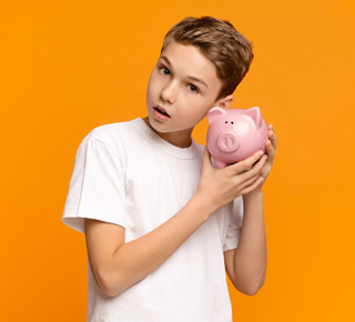 boy holding piggy bank