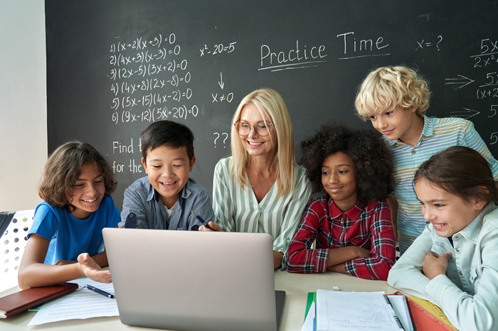 Teacher and Students In Front of a Blackboard