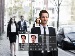 A man walking on a city street being scanned by facial recognition technology, showing a digital overlay with his profile details and a match result.