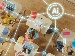 Top-down view of a classroom where children sit at desks using laptops and tablets, connected by glowing digital AI network lines, showing how artificial intelligence supports learning.