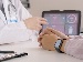 Photo showing a healthcare professional reviewing a digital heart monitor display with AI data analytics graphics overlaid, illustrating AI’s role in predicting patient health risks.